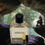 A bottle of perfume sitting in the middle of a cave.