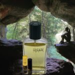 A bottle of perfume sitting in the middle of a cave.