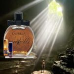 A bottle of perfume and a man in the middle of a cave.