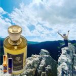 A bottle of perfume on top of a mountain.