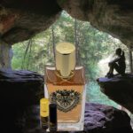 A bottle of perfume sitting in the middle of a cave.