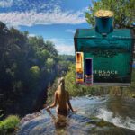 A woman in the water with a bottle of perfume.