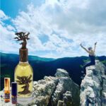 A bottle of perfume on top of a mountain.