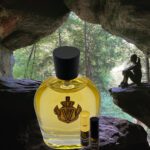 A bottle of perfume sitting in the rocks