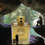 A bottle of perfume sitting in the middle of a cave.