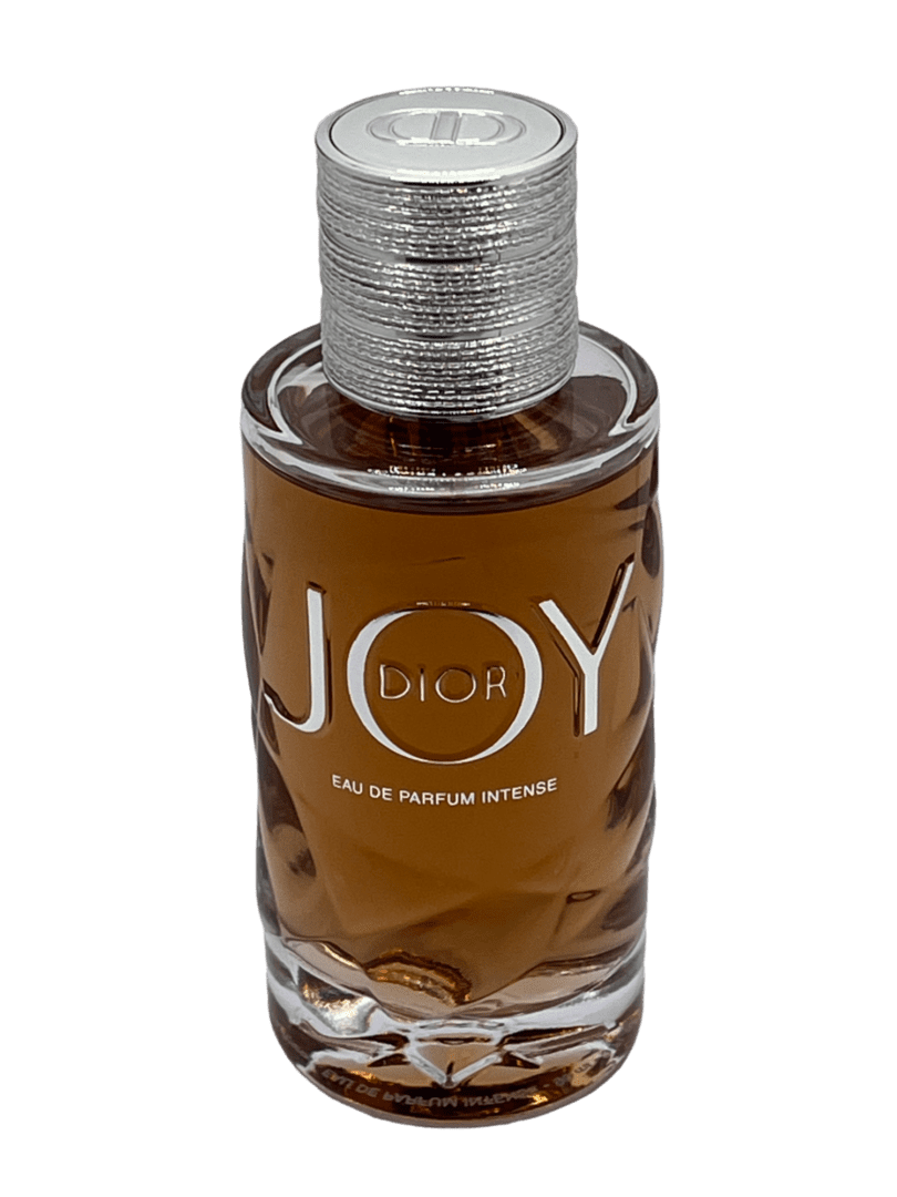A bottle of perfume with the word joy written on it.