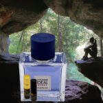 A bottle of perfume sitting in the middle of a cave.