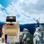 A bottle of perfume on top of a mountain.