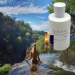 A woman in the water with juliette loca n gray cologne.