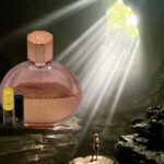 A bottle of perfume and some bottles in the middle of a cave.