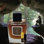 A bottle of perfume sitting in the middle of a cave.