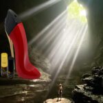 A person standing in front of a cave with a red shoe.