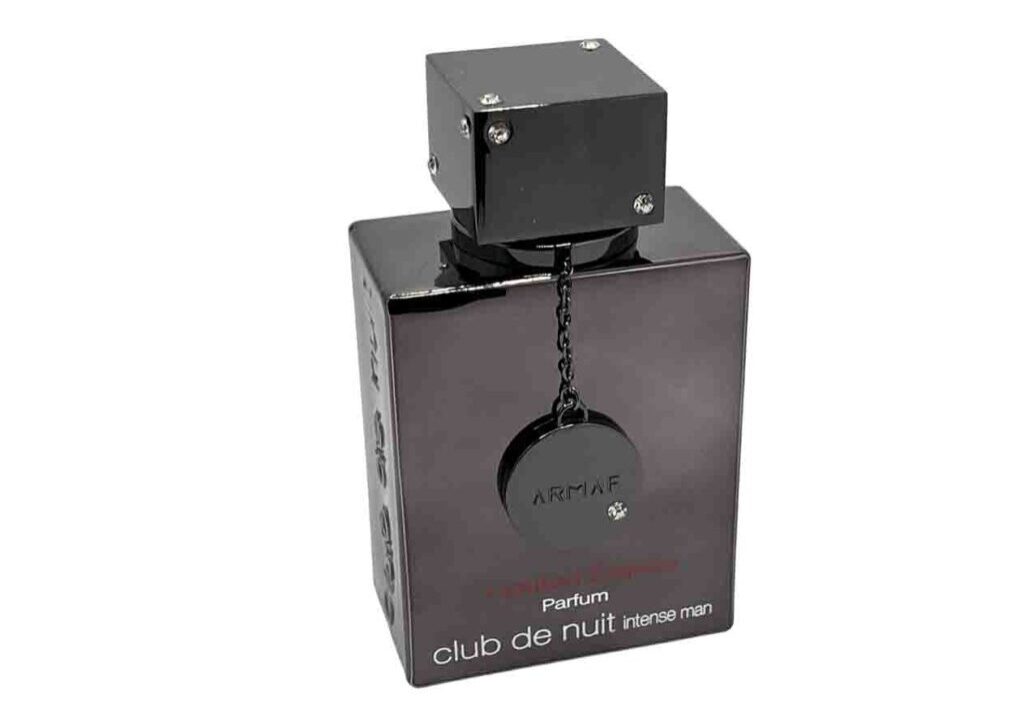 A black box with a square shaped object on top of it.